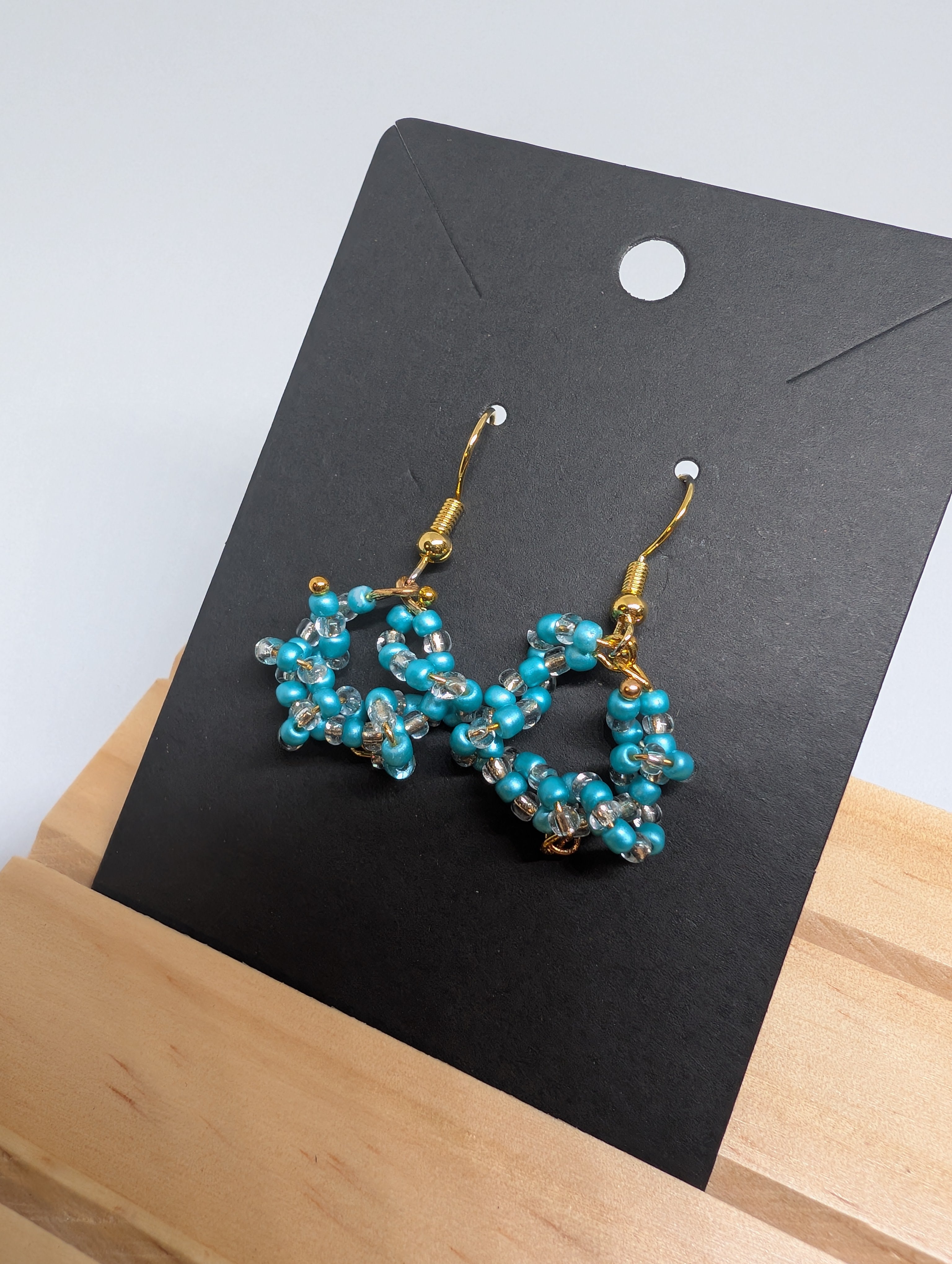 Turquoise Star Hoops, handmade beaded earrings in blue, clear and gold