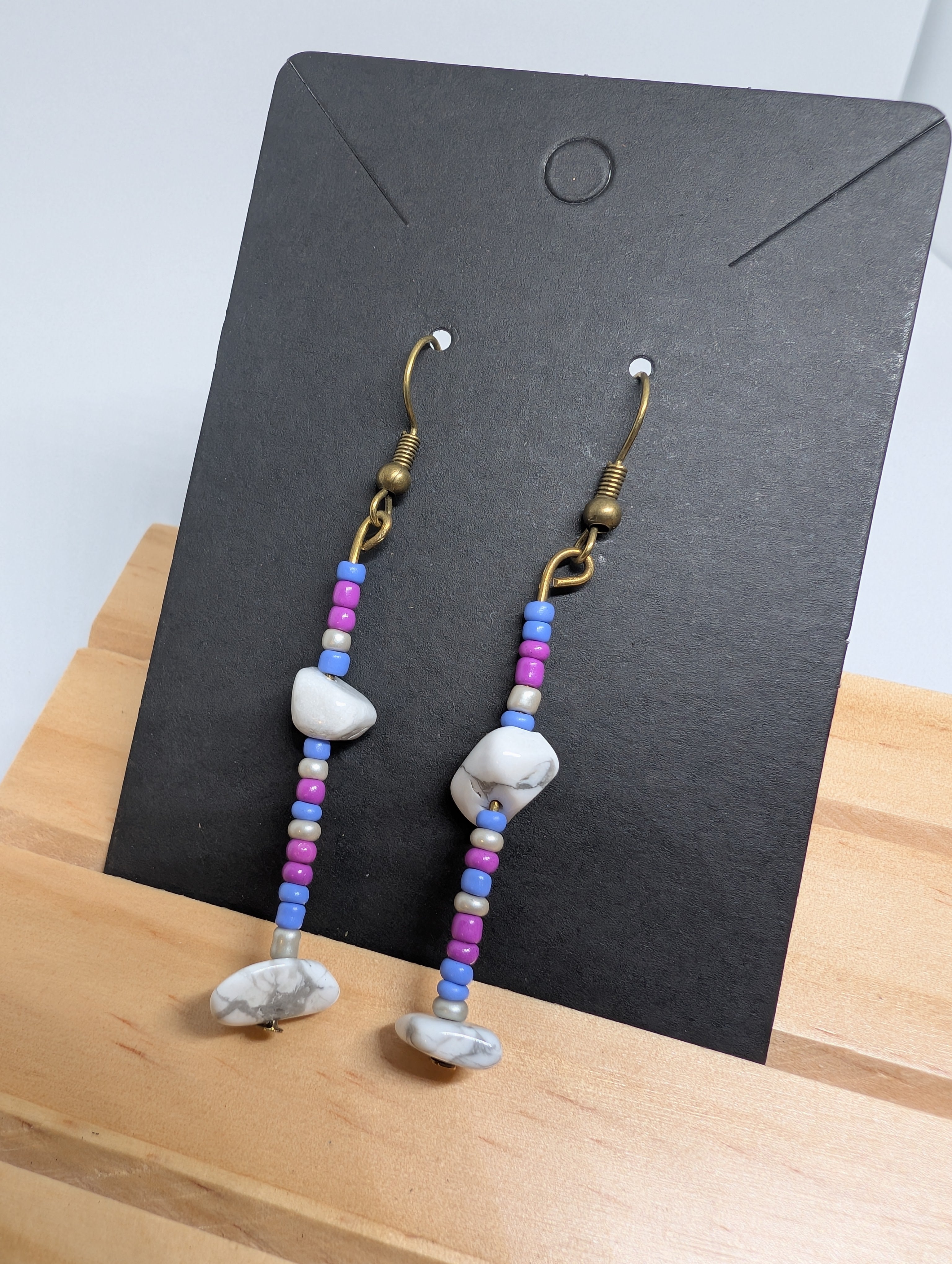Cornflower And Marble, handmade beaded earrings in blue, pink, white and bronze