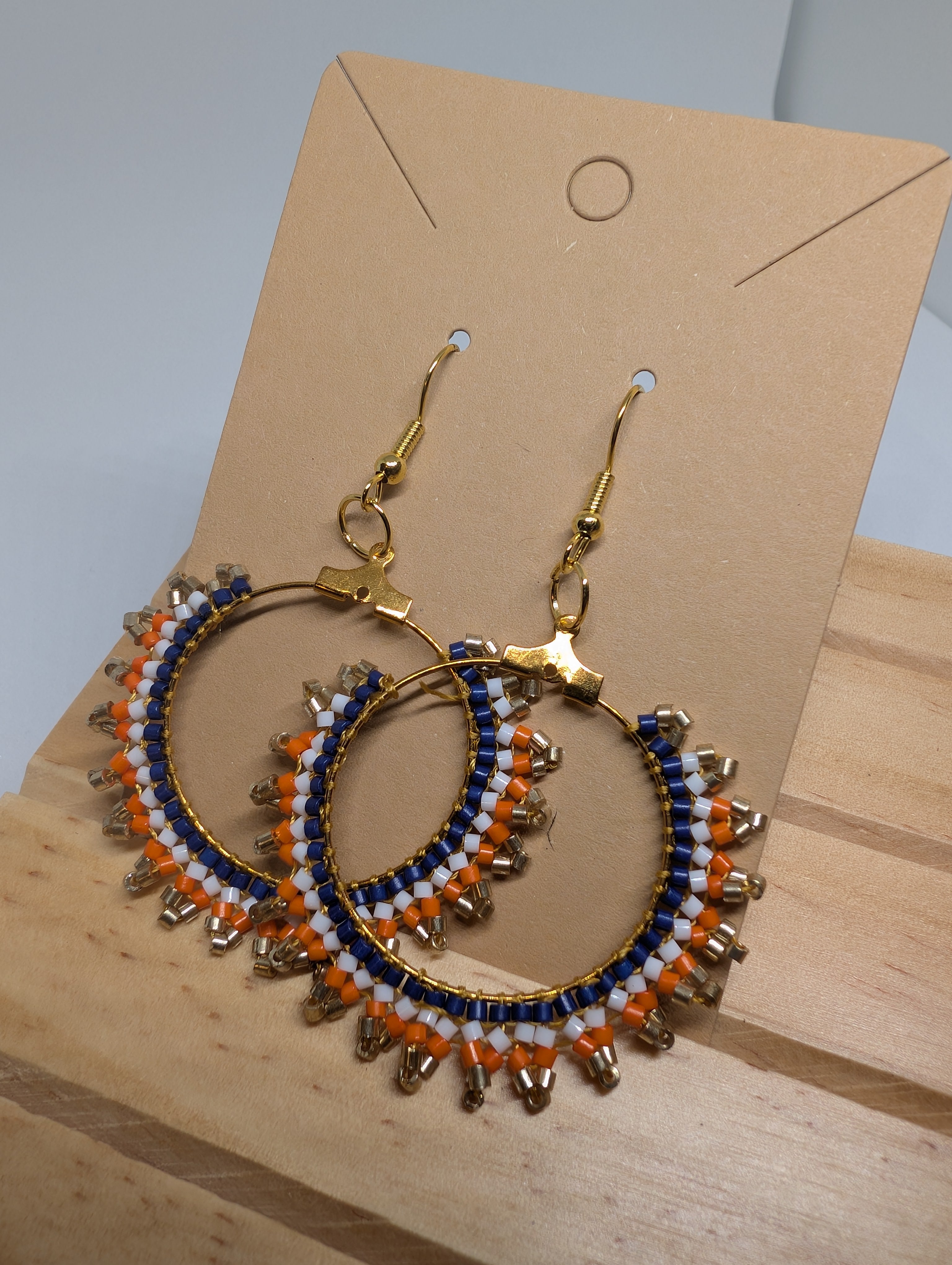 Navy And Orange Hoops, handmade beaded earrings in blue, orange, white and gold